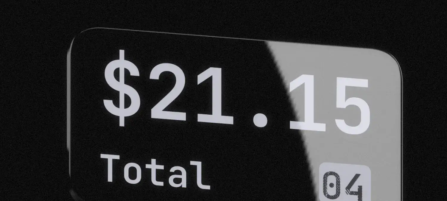 Anzeige eines digitalen Displays mit einem Gesamtbetrag von 21,15 US-Dollar, umgeben von einem schwarzen Hintergrund.