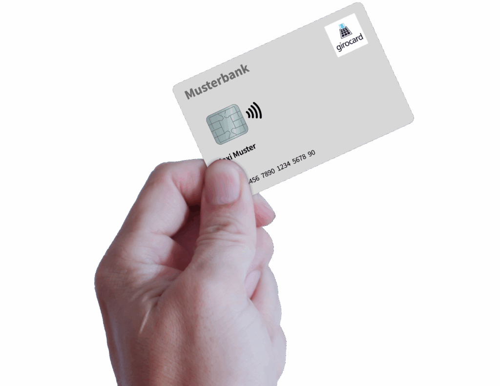 Hand hält eine Musterbank Girocard mit kontaktloser Zahlungsfunktion, personalisiert mit dem Namen Max Muster und einer Chipkarte.